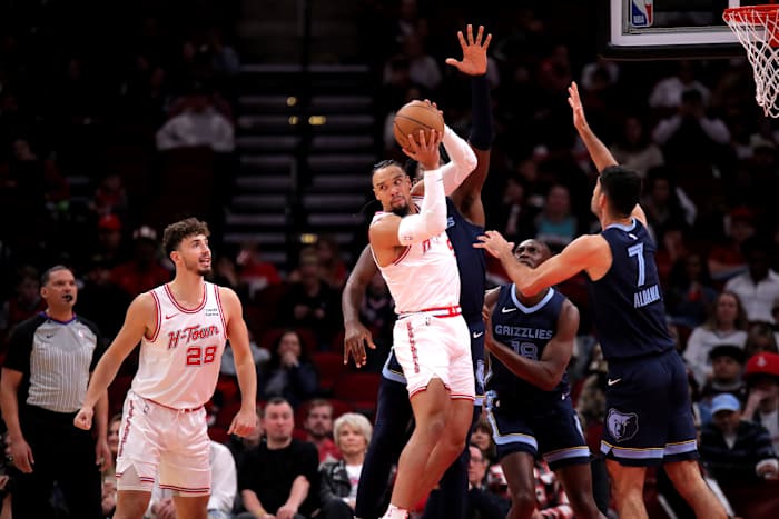 Rockets forward Dillon Brooks looks to pass to a teammate against the Memphis Grizzlies during the first quarter during the first quarter at Toyota Center.